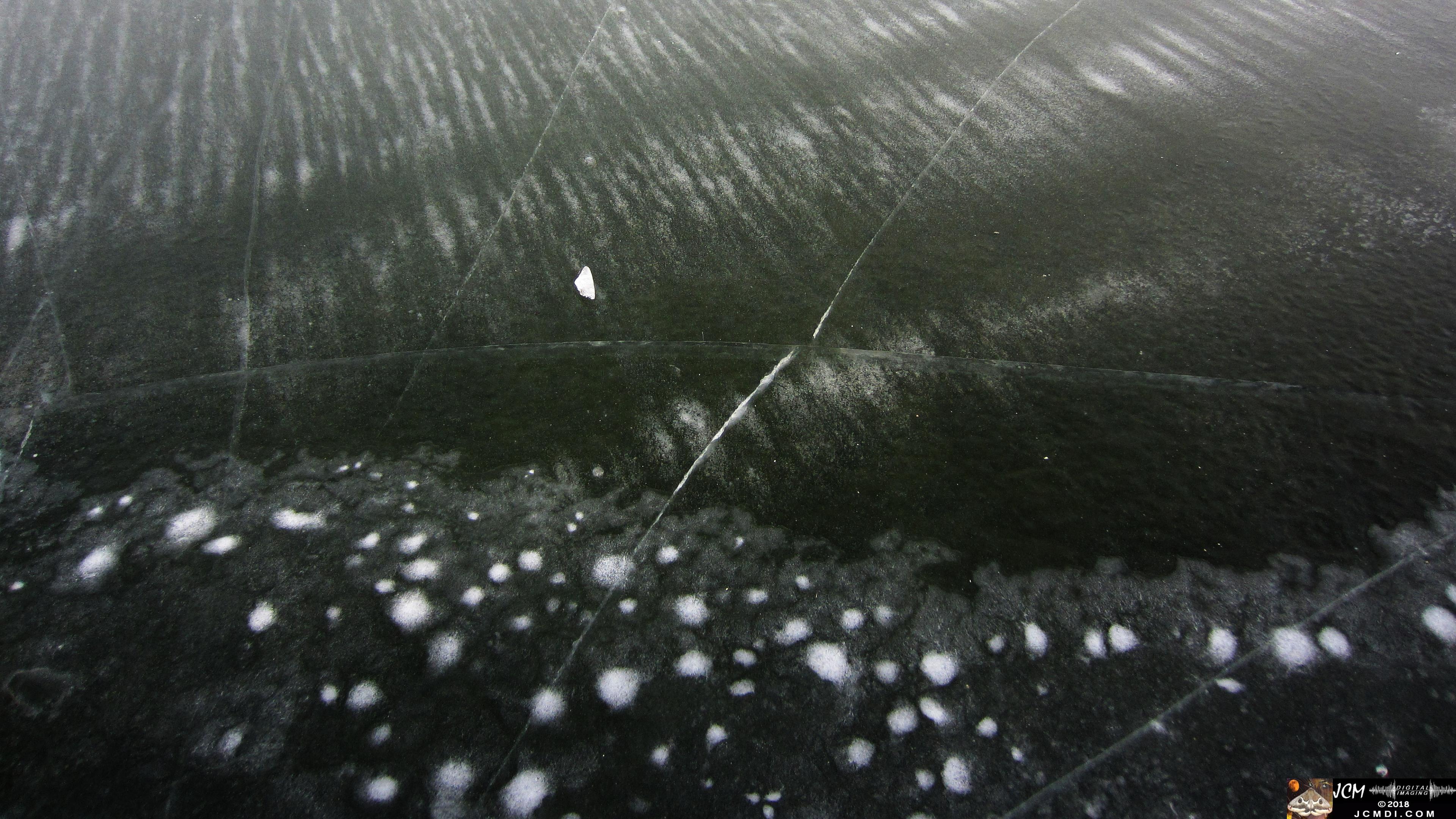 Frozen Lake in Tennessee with cracked clear ice